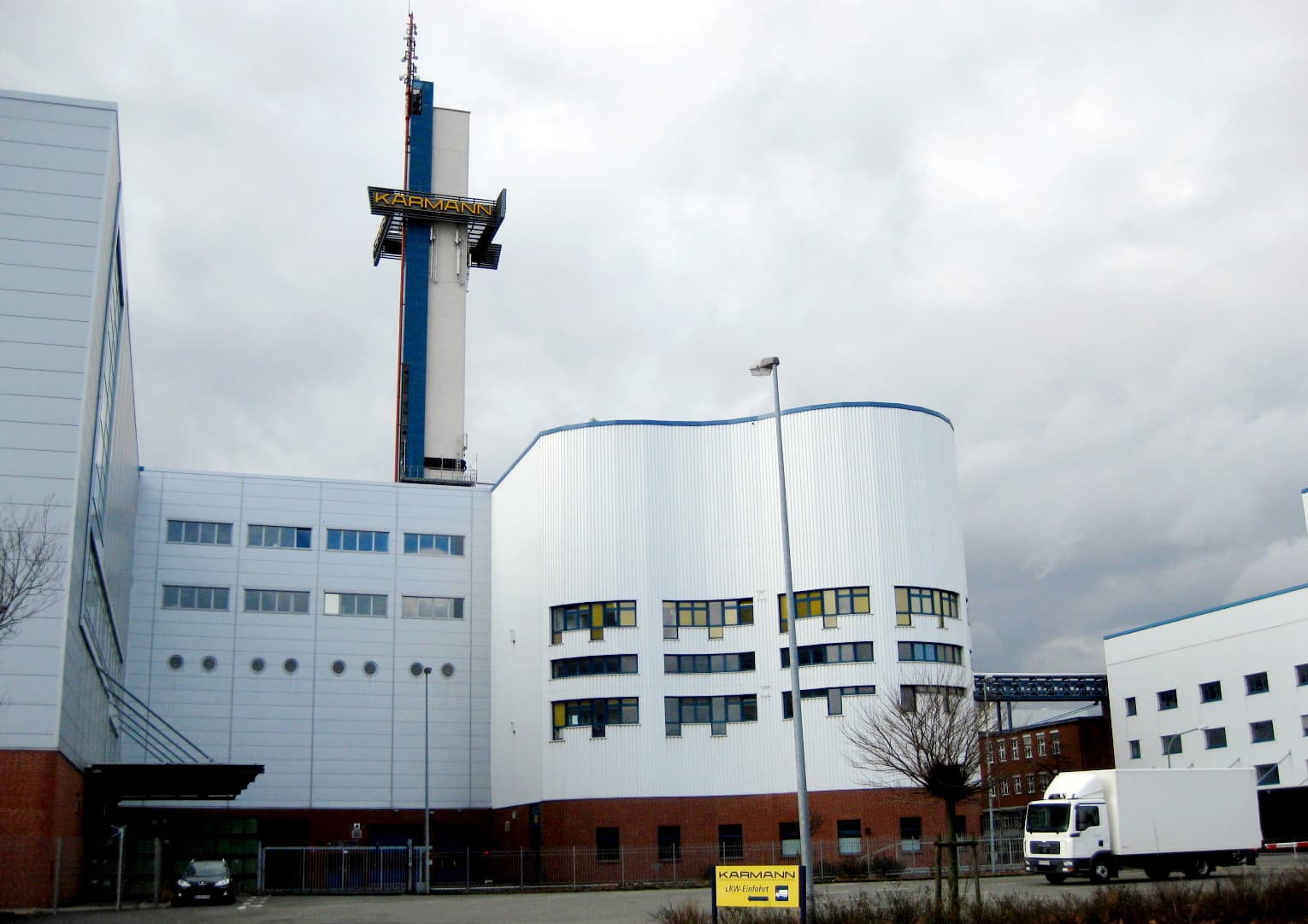 White factory buildings with a tower carrying the KARMANN sign, photographed in 2010.